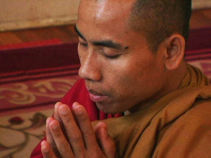 Man from Burma at home praying